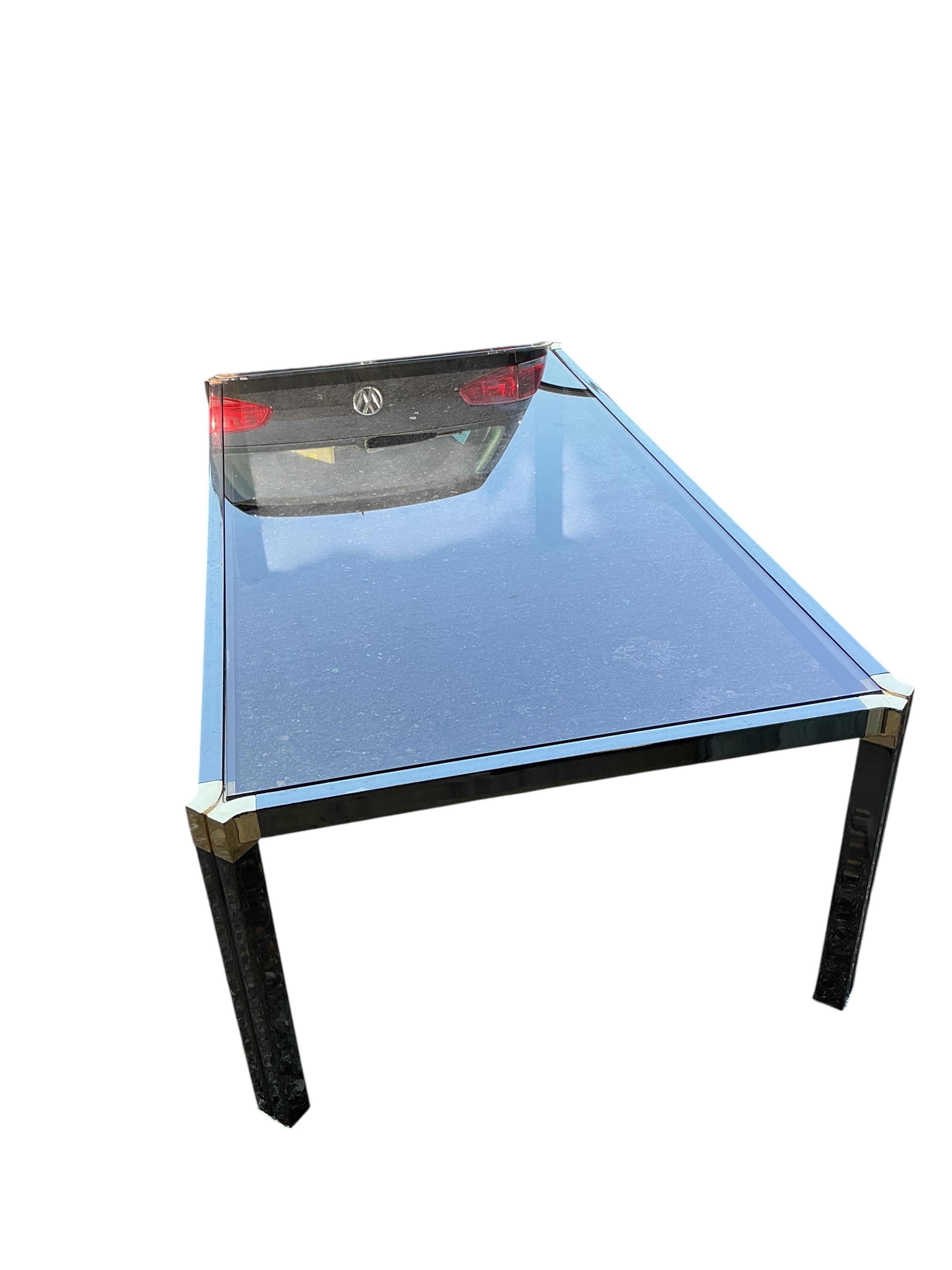 A Pierre Vandel rectangular glass top coffee table. Width 115cm, depth 60cm, height 37cm.